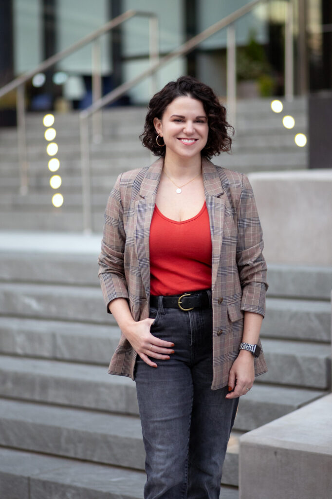Sara standing in front of an office building